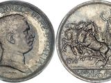 a close up of a silver coin with a man on a horse