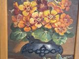 a painting of flowers in a blue vase on a table