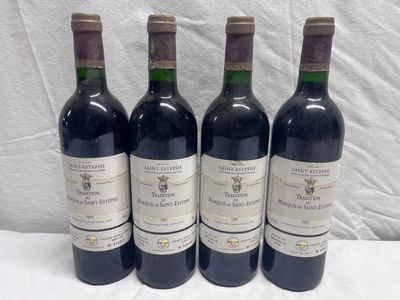 four bottles of wine are lined up on a table