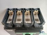 a close up of a group of four circuit breakers on top of each other