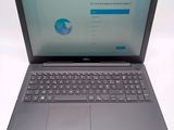 the dell laptop is open and ready to be used