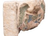 a stone sculpture of a bird with a man on it