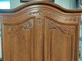 an image of a wooden armoire in a living room