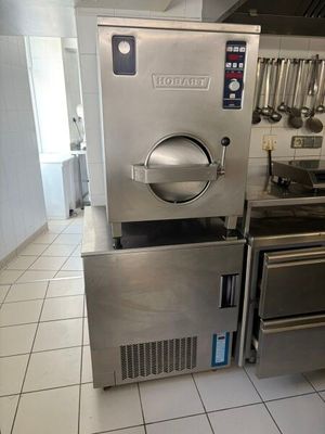 a kitchen with a stove, oven, and other appliances in it