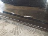 a close up of a car door with a sticker on it