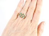 an image of a woman ' s hand with a ring on it