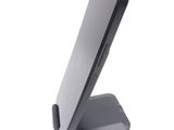 a cell phone on a stand on a white surface