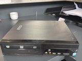 a computer sitting on top of a desk in a room