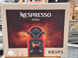 a box with a coffee machine on top of it in a store