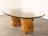 an image of a table with a glass top and wooden legs