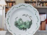 a plate that has a picture on it on a table