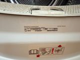 a close up of a washing machine with a label on it