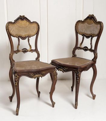 pair of antique chairs with cane back and cane seat