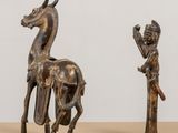 pair of bronze figurines of a horse and a man