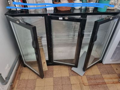 two glass doors that are open on the floor