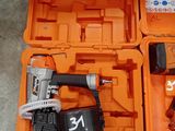 an orange tool box with tools in it sitting on the floor