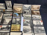 a lot of old postcards that are on the table