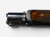 an image of a close up of a gun on a white surface