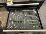 many wrenches in the drawer of a tool box