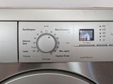 a close up of a washing machine with the controls on