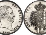 a close up of a coin with a crown on top of it