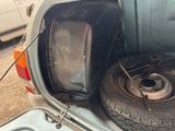 a car that has a tire in the back of it
