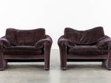pair of purple velvet lounge chairs in the style of giani