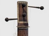 an image of a wooden object with a string attached to it
