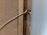 a picture of a piece of wood with a rope on it