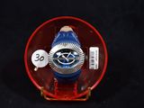 a red and blue watch sitting in a red case