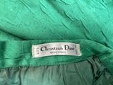 a close up of a green jacket with a label on it