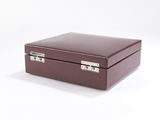 brown leather jewelry box on white background with clippings on the lid