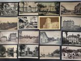 many pictures of old buildings on display on the wall