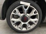 a close up of a car tire with a sticker on it