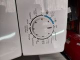 a close up of a washing machine with a timer on it