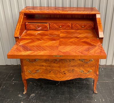 an image of a wooden desk with drawers on it