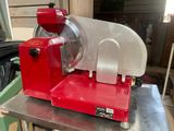 a red machine that is sitting on top of a table