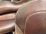 a pair of brown shoes that are sitting on a table