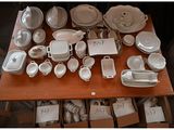 a table with a lot of dishes and cups on it