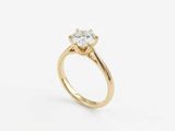 une bague de fiançailles en or sertie d'un seul diamant