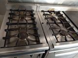 two burners on the stove in the kitchen