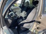 the interior of a car with the door open and the driver ' s seat up