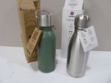 two water bottles sitting next to each other on a table