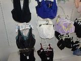 a lot of underwear hanging on a rack in a store