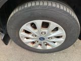 a close up of a tire on a car ' s rim