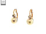 pair of pearl and diamond earrings on a white background