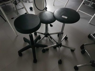 three stools sitting on top of each other in a room