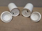 three cups that are sitting on a table