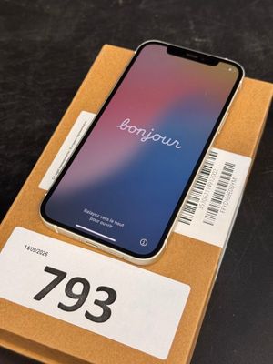 an iphone x in a box on a table with a price tag on it