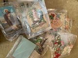 many religious cards in plastic bags on the floor